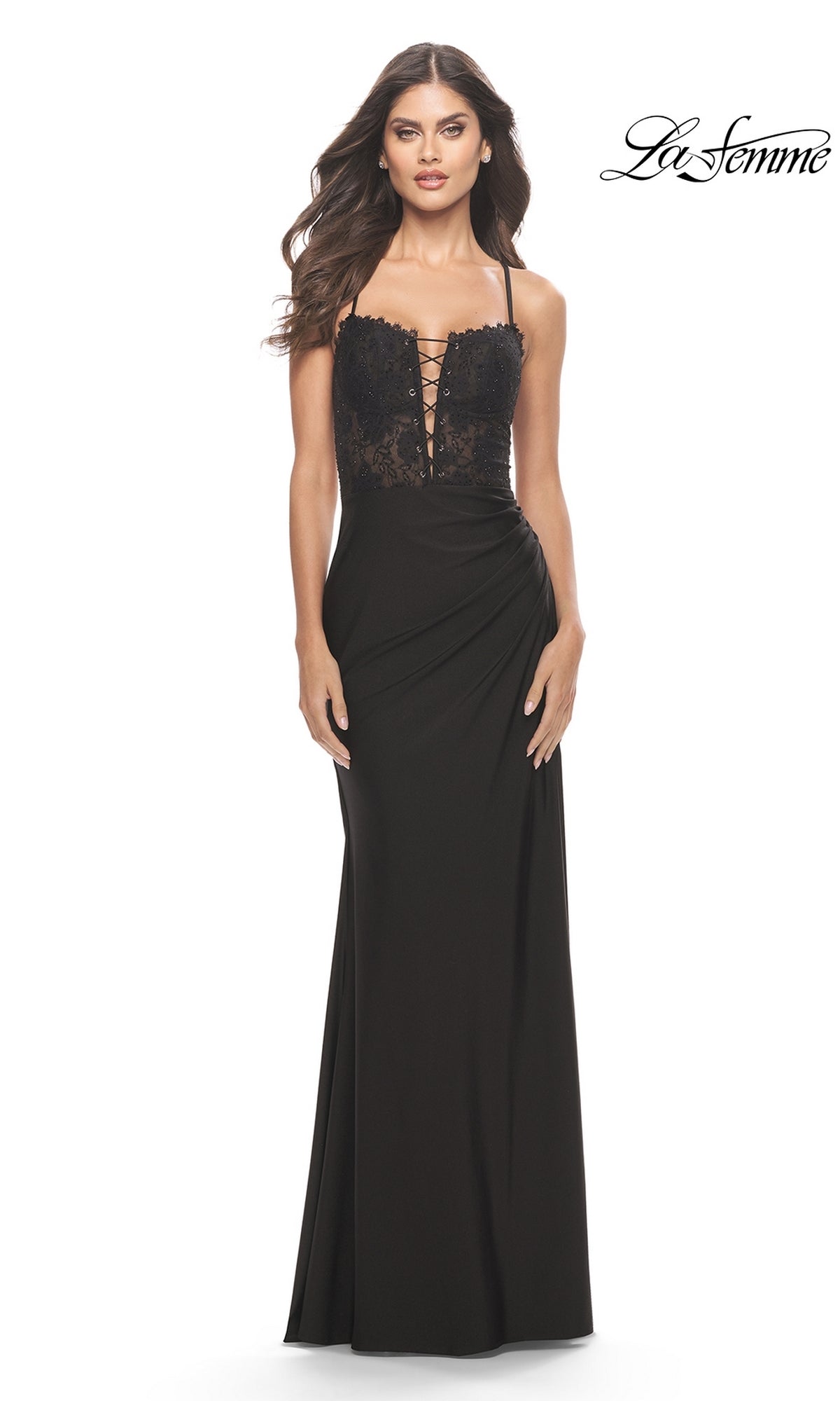 A woman models the La Femme Long Prom Dress 31567, featuring a black lace bodice and spaghetti straps; the fitted gown flows gracefully to the floor against a plain white background.